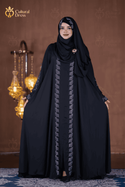Looking for Abaya in BD? Discover an elegant black Dubai Cherry Abaya with detailed stone work, 250-inch flare and 90-inch long hijab. Shop online in Bangladesh.